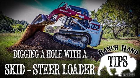 digging a hole with a skid steer|skid steer lawn digging.